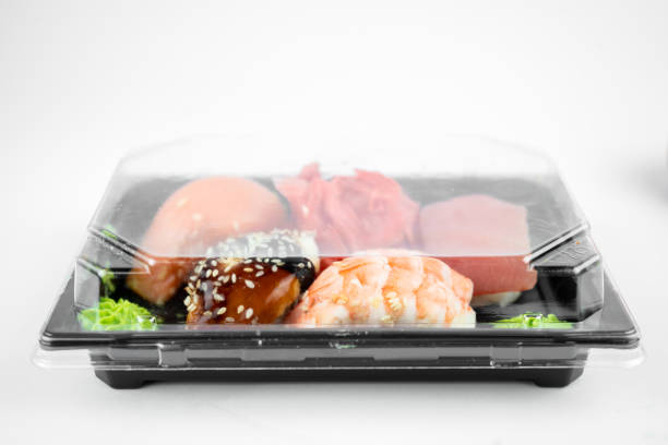 istock take away sushi in plastic container, pink ginger, wasabi. sushi delivery concept 1307599920