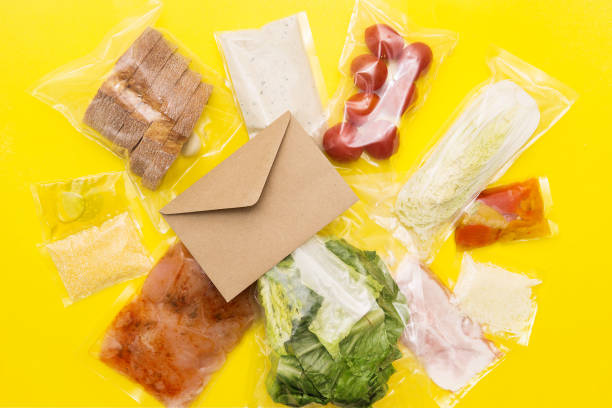 istock Salad dinner set: chicken, lettuce, tomatoes, peking cabbage, cheese, bacon, bread, olive oil sauces and spices. A set for delivering food for dinner on a yellow background. I cook at home 1307604115