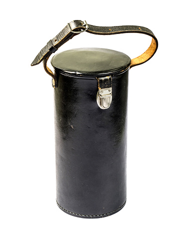 Shabby black leather tube for a lens on a white background