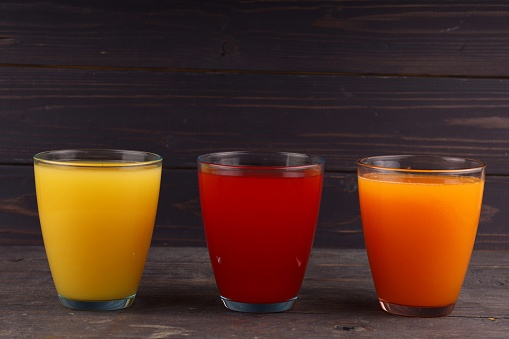 Fruit juice in plastic cup. Photo is taken in 16 bit color depth with medium format camera