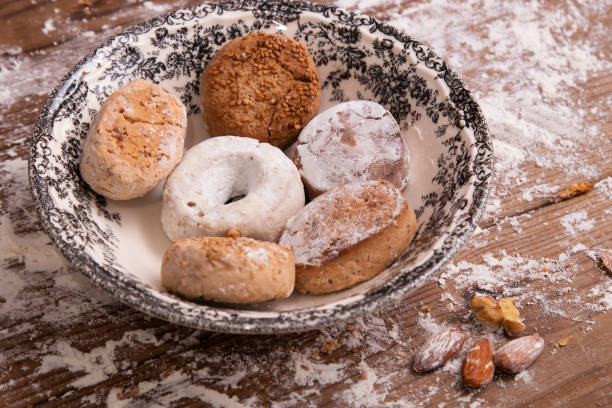 istock plate with powders and shortbreads on wooden table with flour 1307606583