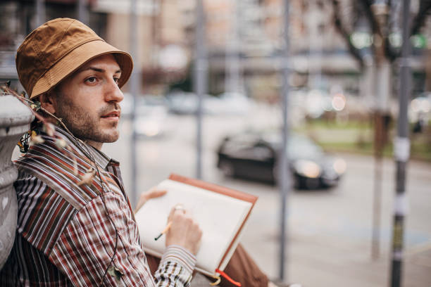 Artist drawing outdoors in city