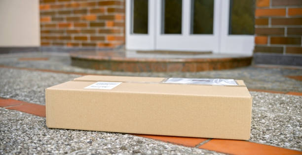 istock Cardboard package at the doorstep during coronavirus pandemic 1307608260