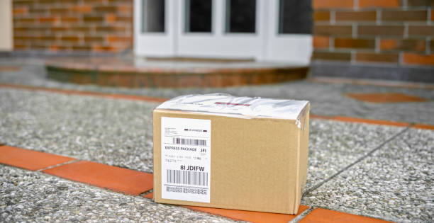 istock Cardboard package at the doorstep during coronavirus pandemic 1307608283