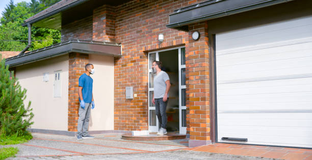 istock Customer collecting pizza boxes from delivery man 1307608351