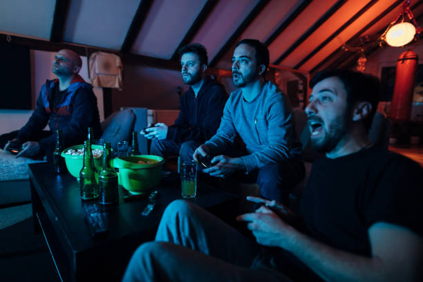 istock Passionate man, can't hide his emotion while playing video game match with his boys 1307610040