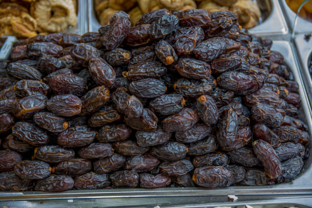 Dried dates (fruits of date palm) for sale in the Mahane Yehuda Market, Jerusalem, Israel stock photo