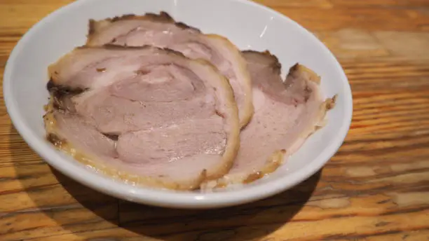 Photo of Chashu pork on white dish for ramen.It is japanese food.