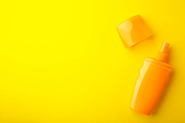 istock Sun protection bottle on yellow background. Summer vacation 1307613982