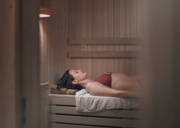 istock Woman lying down in sauna 1307615012