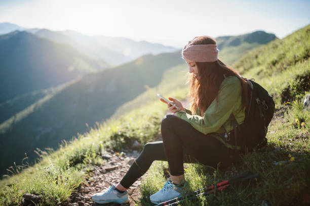 istock Young woman using tecnology in the mountain. 1307616269