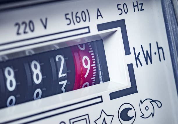 Payment of utility services, concept. Part of an electricity meter, close-up. Selective focus, toned image. stock photo