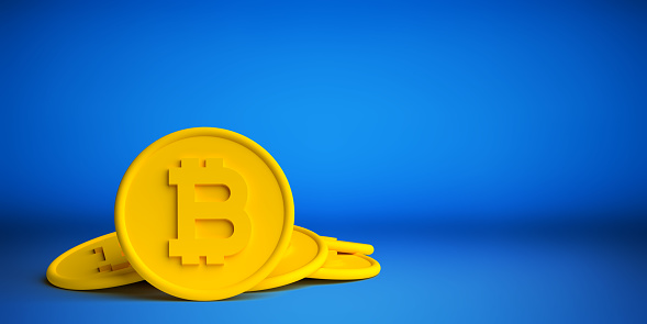 Cryptocurrency, digital money, finance and trade concepts: Modern and clear design, 3D rendered yellow color, plastic bitcoins on blue background with large copy space.