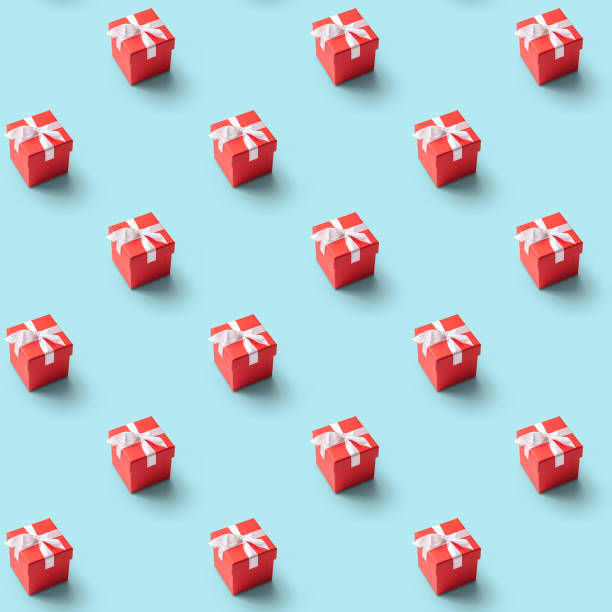 seamless pattern of red present box with white ribbon on  blue background. Concept and celebration
