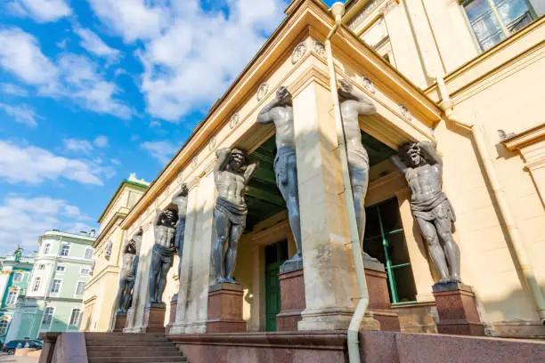 Portico of New Hermitage building with Atlantes in Saint Petersburg, Russia