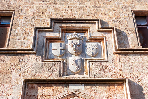 Coats of arms on wall of Knight street on Rhodes old town, Greece