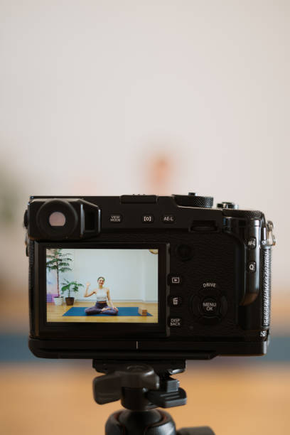 istock Woman teaching online yoga glasses on camera screen 1307623726