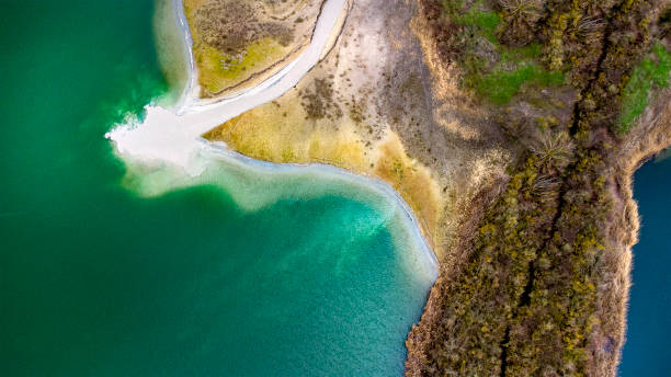istock Gravel and sand open pit mining, pond with sediments - aerial view 1307625761