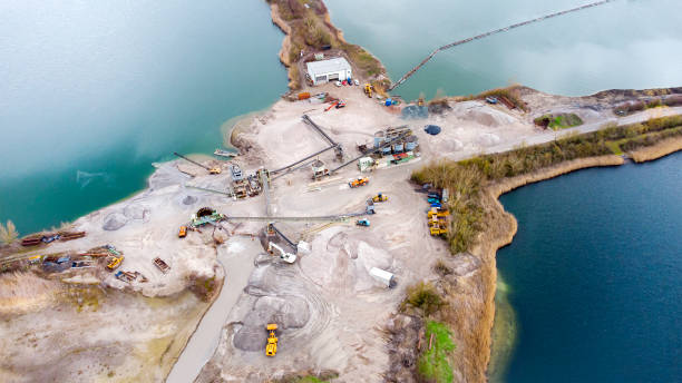 istock Sand and gravel pit, lake - aerial view 1307625809