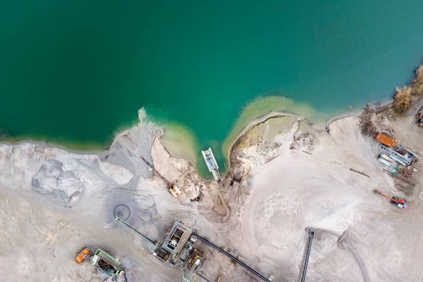 istock Sand and gravel pit, lake - aerial view 1307625822