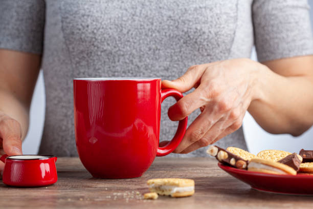 istock Adding creamer into a cup of hot beverage 1307630682