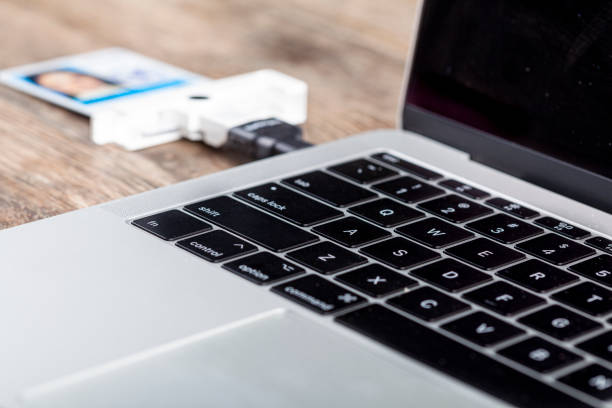 istock Using A personal identity verification (PIV) card to login to a secure laptop 1307631483