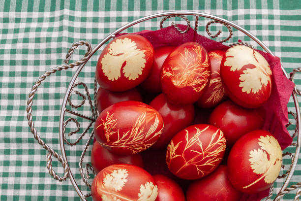 istock Painted Easter eggs in onion husks with abstract drawings are in a basket 1307631669