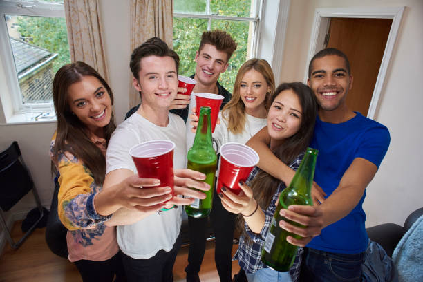 student gang cheers student flat mates college dorm party stock pictures, royalty-free photos & images