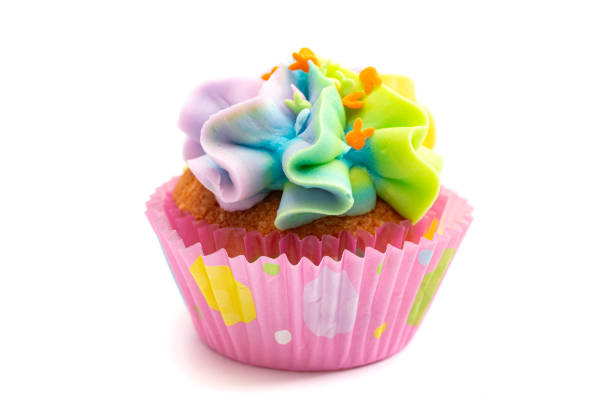 istock Pastel Rainbow Frosted Easter Cupcakes  Isolated on a White Background 1307635260
