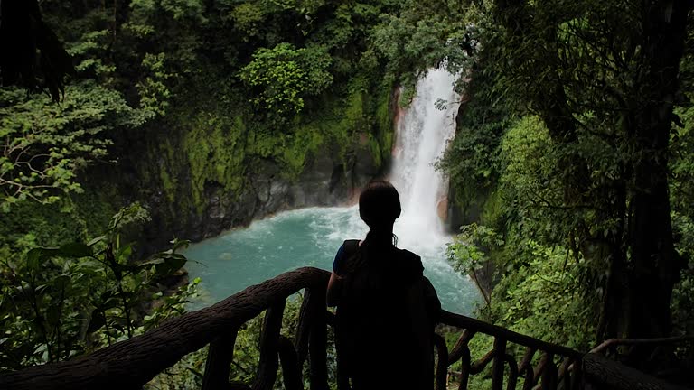 Girl looking at the waterfall HD 9