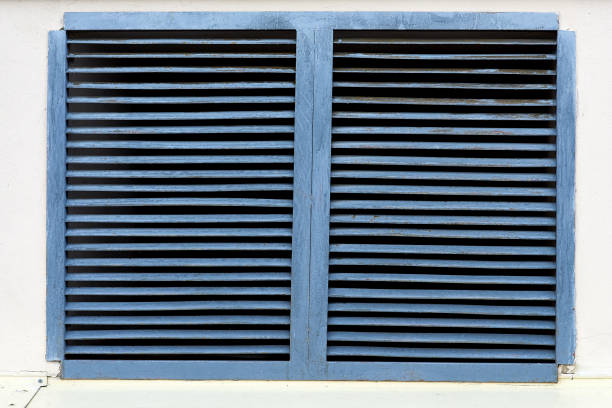 istock A blue ventilation grate on a white brick wall. Detail, close-up 1307638540