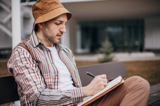 istock Male artist drawing on paper 1307638553