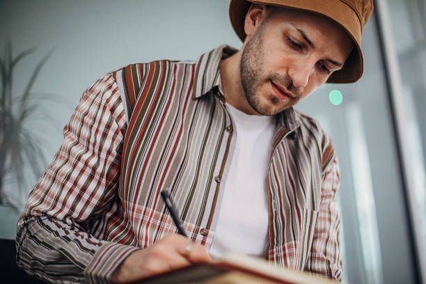 istock Male artist drawing on paper 1307638782