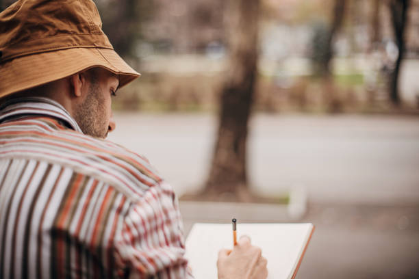 Artist drawing outdoors in city
