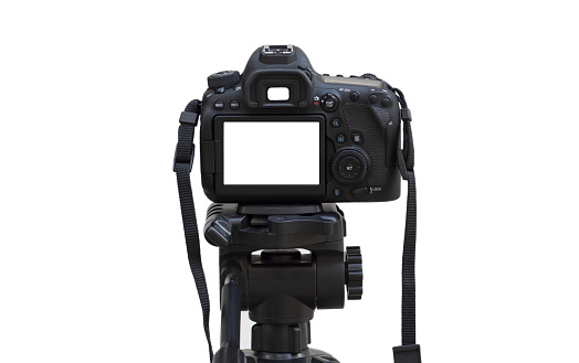 Dslr camera with white screen on the tripod isolated on white background. White screen camera