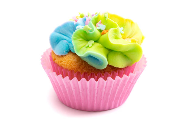 istock Pastel Rainbow Frosted Easter Cupcakes  Isolated on a White Background 1307638933