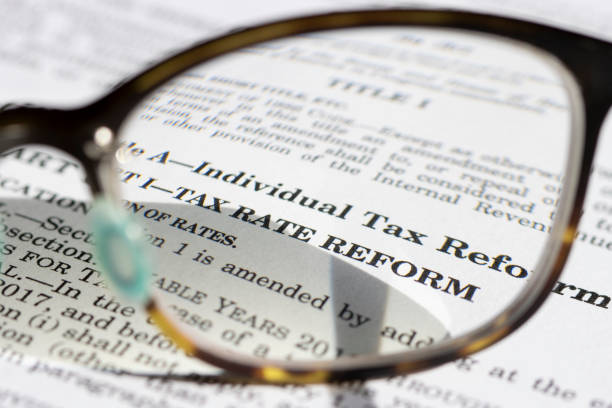 Closeup of the documents of the Tax Cuts and Jobs Act (TCJA) of 2017. The Biden administration eyes the first major tax hike since 1993 in the next economic plan.