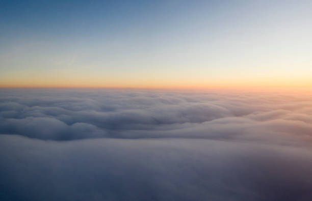 istock Dawn or sunset over the clouds, blue hour, aerial view. 1307642596