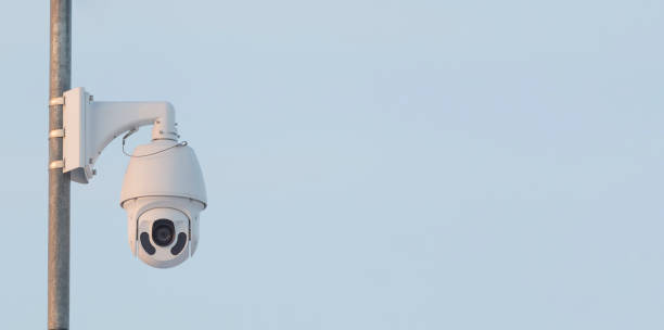 istock Swivel high quality CCTV camera on sky background. 1307643265