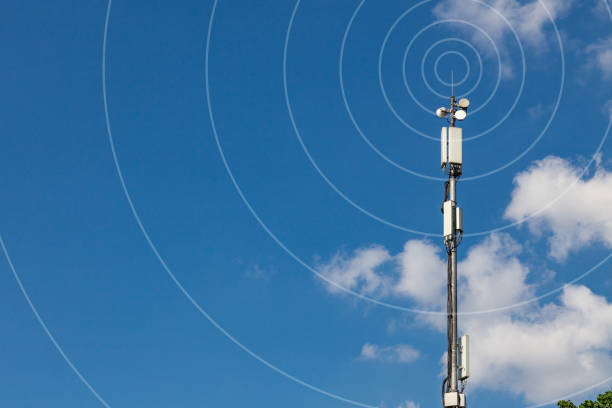 istock High metal pole with mobile communications equipment on a background of blue sky 1307643302