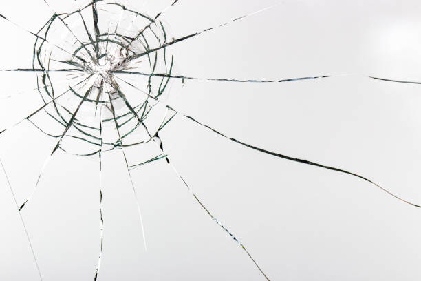istock Cracks on the glass on a white background. 1307643319