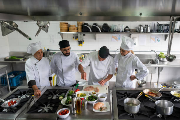 istock Group of cooks cooking at a restaurant 1307643474