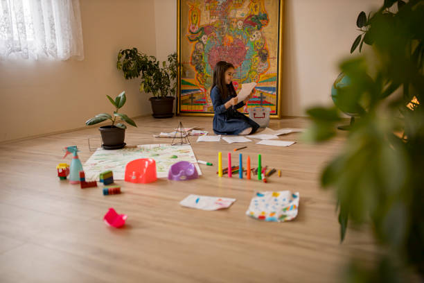 istock Cute little girl drawing and playing 1307645980