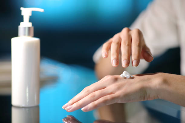 istock Woman hands rubbing moisturizer cream in the night 1307649350