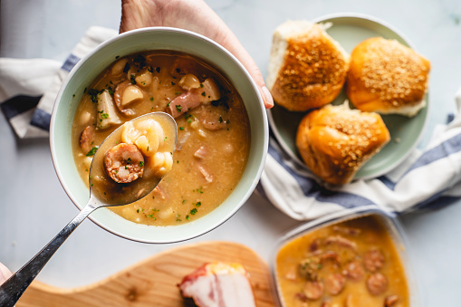 Kidney Beans soup with smoked sausage and bacon in plate on the table