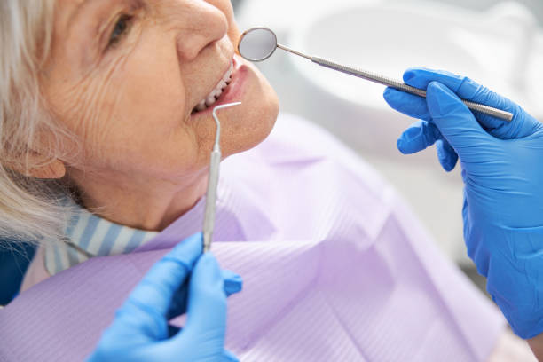 istock Inspection of teeth performed with dental mirror and probe 1307652114