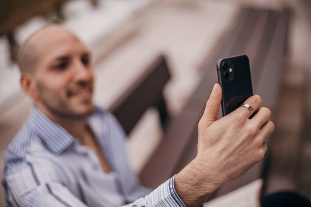istock Modern fashionable man taking a selfie 1307653315