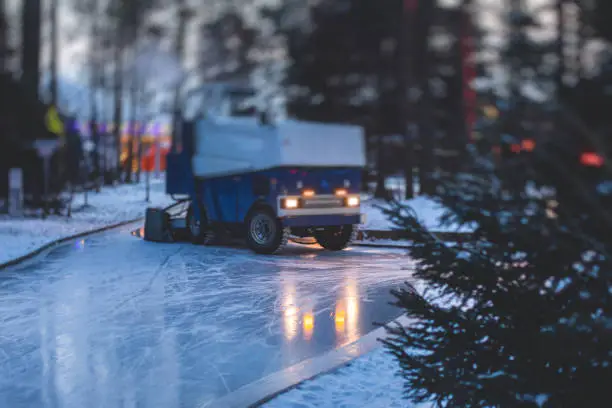 An ice resurfacing machine, ice resurfacer on a ice rink, resurfacing and maintenance of the ice rink with a new year decoration and illumination
