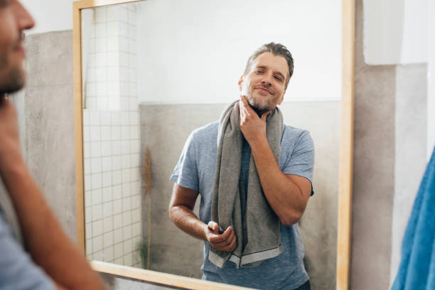 istock Handsome Young Man Drying off with a Towel in the Bathroom 1307656364