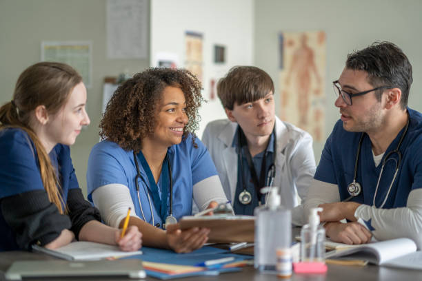 istock Multi Ethnic Group of Students in Medical Training Class 1307657213